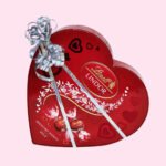 Lindt Lindor heart shape milk chocolates in red gift box.
