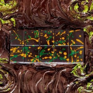 Slice of Dark Chocolate Knafeh topped with crispy golden pastry and rich melted chocolate drizzle.